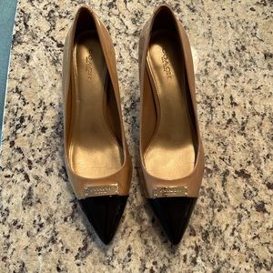 Coach patent pumps